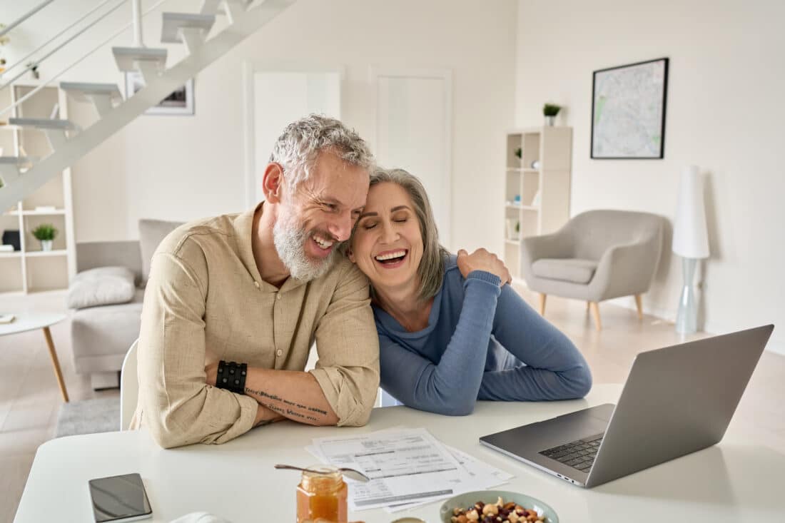 Happy,Mature,Older,Family,Couple,Laughing,,Bonding,Sitting,At,Home