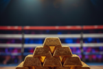 Gold bars stacked inside a boxing ring symbolizing the Federal Reserve meeting impact on gold and silver prices