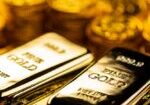 Gold bars illustrating the gold and silver outlook ahead of key economic events.