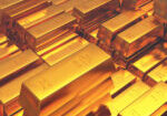 Gold bars and silver coins rising as weak U.S. payroll data boosts precious metals and weakens the U.S. dollar